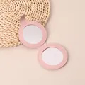 Portable foldable mini pink PU leather makeup mirror with dual mirrors and snap closure - Round Pink