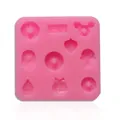Detail showing pink silicone chocolate mold with various heart and cupcake shapes - Y-01 Style (Y-01) / Pink