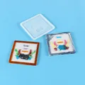 Detail view of DIY silicone mold with completed colorful resin coasters on blue background - Crab Pattern (60-1042)