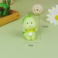 Detailed close-up of a cute green resin dinosaur figurine with dimensions 5.3cm x 3cm - Cartoon Resin Dinosaur