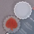 Detailed view of scalloped wave silicone mold with finished orange resin coaster - Round Wave Style (60-236)