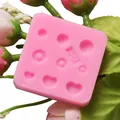 Detailed macro view of a pink silicone mold with heart and circular textured patterns for baking - Y-08 Style (Y-08) / Pink