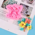 Pink silicone flower mold with detailed resin floral samples on magazine background - Branch Flower Mold (50-2815) / Pink