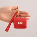 Compact red PU leather mini pouch keychain ideal for stylish earphone and coin storage - Red