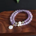 Detailed view of a double-layered amethyst bracelet with elegant white jade pendant - Peace Buckle Double Bracelet (TA-BR-965) / Light Purple (Amethyst)