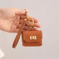 Stylish brown mini PU leather bag keychain earphone pouch featuring elegant gold hardware - Brown