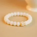 Handmade natural white Bodhi root seed bracelet with a cute charred cat paw charm - Round Bead Cat Paw Style