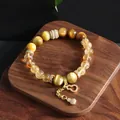 Detailed view of citrine and tiger's eye beaded bracelet with gold gourd charm - Gourd Pendant Style / Golden Tiger Eye Yellow Crystal Bracelet