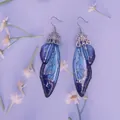 Ätherische S925 Silber-Ohrringe mit blau-violetten Schmetterlingsflügeln im Verlauf - Farbverlauf Blau-Silberfolie