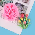 Detailed view of pink tulip silicone mold with finished colorful plaster craft - Tulip Flower Mold (50-2817) / Pink