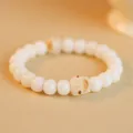 Artisanal white bodhi root bead bracelet featuring a cute charred cat design charm - Round Bead Cat Paw and Kitty Style