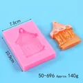 Detail view of carousel silicone mold sized 10.9cm x 7.8cm with finished resin cast sample - Carousel (50-696) / Pink