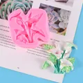 Close-up detail of pink silicone flower mold with a finished calla lily plaster ornament - Lily Flower Mold (50-2818) / Pink