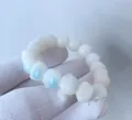 Handcrafted white bodhi root bracelet with cute cat paw beads and blue cat eye effect - Ice Blue Cat Paw