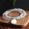 Detail shot of double-strand grey moonstone and clear quartz bracelet with donut pendant - Grey Moonlight Peace Buckle Bracelet