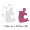 Puzzle shaped silicone coaster mold including dimensions and a resin sample piece. - Puzzle Piece Shape (60-524)