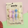 Close-up of 4pcs star-shaped twisted birthday candles in colorful retail packaging card - Five-pointed Star / Twisted Star Shape (4 Pieces)