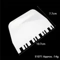 White plastic baking scraper with comb edge dimensions 10.7x7.7cm - Comb Tooth Sawtooth Scraper (51071) / White