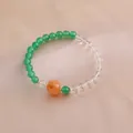 Elegantes Naturkristall-Armband mit grünen Achatperlen und einem orangefarbenen Kürbis - Grün Transparent Orange Kürbis Hauptperle Stil