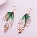 Macro view of translucent green cicada wing earrings with shiny gold foil flakes - Gold Leaf Design / Large Green