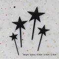 Détail montrant quatre tailles de toppers de gâteau en étoile noire 3D pour la pâtisserie - Étoile 3D (cp-021) / 4 Pièces/Paquet / Noir