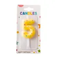Yellow number 5 birthday candle with colorful star patterns in premium retail packaging - Number 5