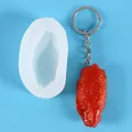 Realistic fried chicken wing silicone mold with sample resin keychain on blue background - Chicken Drumette (50-2834) / White