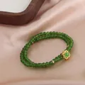 Elegante bracciale a due fili di perline verdi tipo giada con ciondolo a fiore dorato - Verde Diaspro