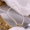 Elegant vintage Baroque freshwater pearl necklace featuring a decorative golden OT buckle - Rice Pearl Necklace / Choker Necklace / White