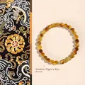 Natural 6mm golden tiger eye stone beaded bracelet with an elegant gold spacer bead - Tiger Eye Bracelet / 6mm