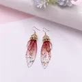 Elegante lange Schmetterlingsflügel-Ohrhänger mit rotem Farbverlauf und Goldfolie - Goldfolie Rosarot