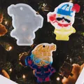 Detailed view of the DIY snowman silicone mold alongside finished colorful resin ornaments - 60-913 White (Snowman with Hat)
