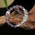 Exquisite detail view of natural amethyst and white quartz beaded bracelet on a wood base - Amethyst White Luminous Single Loop Bracelet