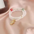 Elegant double-strand white bead bracelet with Buddha charm and colorful accents - White Lucky Bead Buddha Style (TA-BR-505) / Warm White