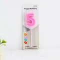 Vibrant pink number 5 birthday candle for cake decoration in its original retail packaging - Pink Number 5