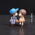Sweet miniature couple figurines on wooden bench for wedding cake topper ornaments - Blue and Pink Bench Couple