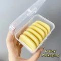 Detail view of yellow butter cookie-shaped makeup puffs in a clear storage box - With Storage Box (AL0837) / Butter Puff Box Set 6 Pieces/Pack
