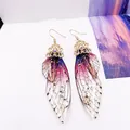 Elegante Schmetterlingsflügel-Ohrhänger mit lila Farbverlauf und Goldfolie Akzenten. - Goldfolie - Lila