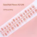 High-resolution detail of 30pcs gradient pink press-on nails on a size-coded plastic strip. - Pink Gradient Glitter Exquisite Style (S087-T) / 30 Packs