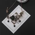 Vintage Gothic Drachenflügel-Halskette mit schwarzem Herzstein an einer Bronzekette - Antikgold-Drachen-Halskette (26#) / Blau