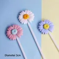 Detailed view of colorful resin daisy cake toppers showing the 3cm diameter size marker - Blue White Pink Set (3 Pieces)