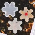 Snowflake silicone mold and resin crafts displayed against a festive Christmas tree. - 60-916 White (Snowflake)