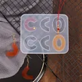 Close-up of a 6-cavity silicone mold with finished resin earrings and pendant - White (60-212)