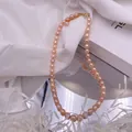 Elegant vintage-style pink natural freshwater pearl necklace with gold-plated clasp - Pink Rice Pearl Necklace / Peach Pink