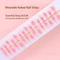 Detailed view of 30pcs peach gradient press-on nails on a pre-made sizing strip. - Pink Gradient Green Leaf Peach Theme Style (S077-T) / 30 Packs