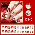 Detail view of cute New Year red press-on nails with cartoon dragon and flower designs - Red and White Dragon Cartoon Flower Style (D840) / 24 Pieces (With Glue)