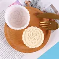 Close-up of rose pattern silicone mold and finished mooncake soap on wooden plate - Rose Style (50-2683) / White