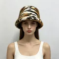 Detailed front view of a stylish tiger-patterned faux mink fur bucket hat on a model - One Size / Siberian Tiger Print