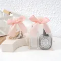 Elegant pink organza drawstring gift bag with large satin bow for jewelry packaging - 9x12cm (Pack of 10) / Champagne