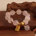 Natürliches Rosenquarz-Perlenarmband mit goldenem Elefantenanhänger im Vintage-Stil - Ganesha Anhänger Armband / Rosa